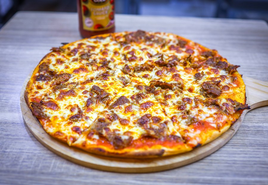 A fresh pizza with melted cheese and toppings.